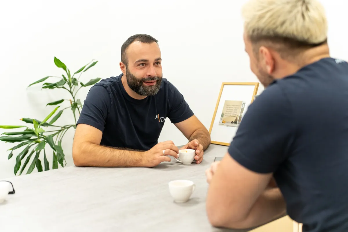 Two colleagues over coffee